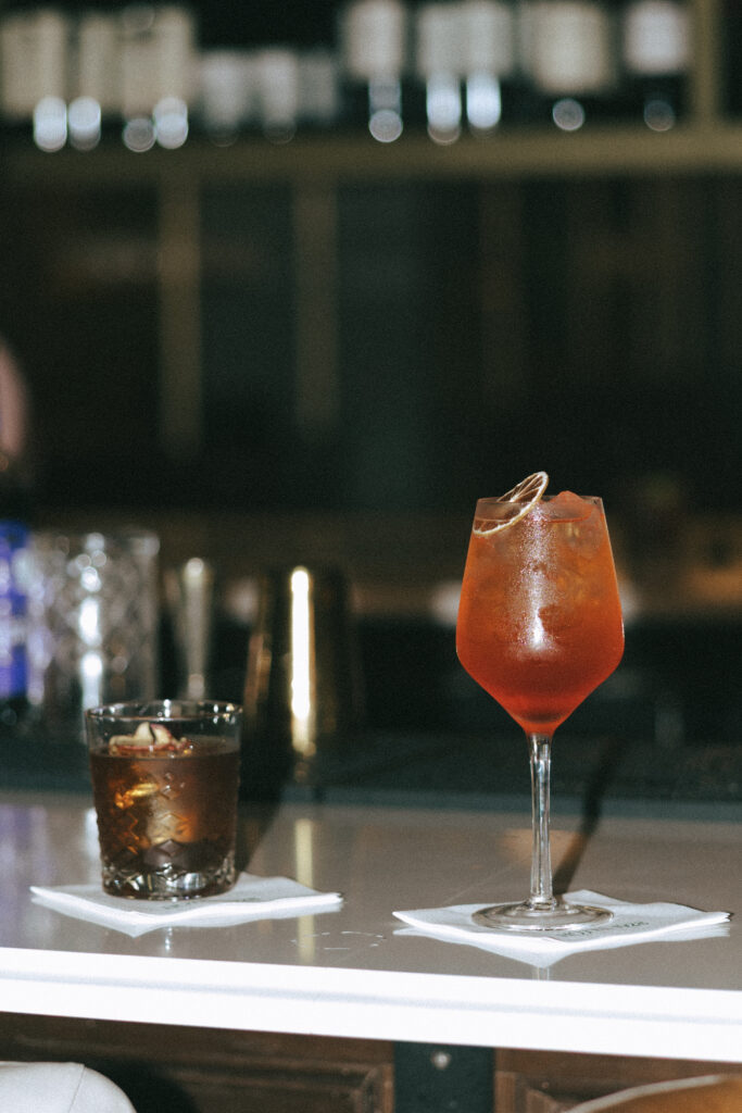 Close-up of drinks on the bar at Hotel 1928 during an intimate elopement.