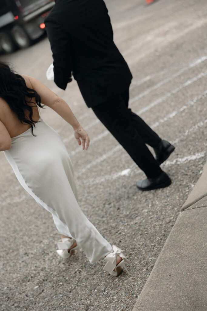 Couple walking out of the courthouse after their elopement.