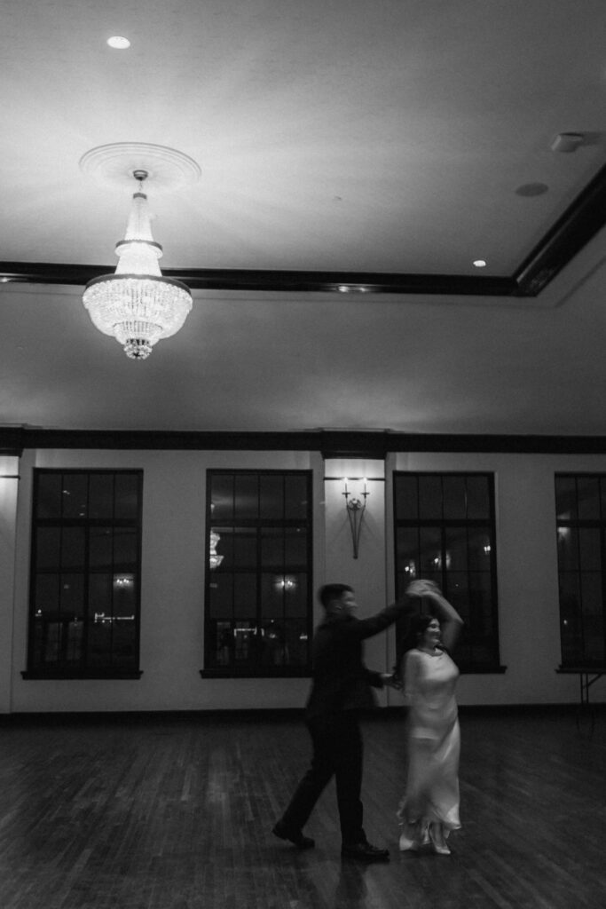 Couple spinning during a ballroom dance at Hotel 1928.