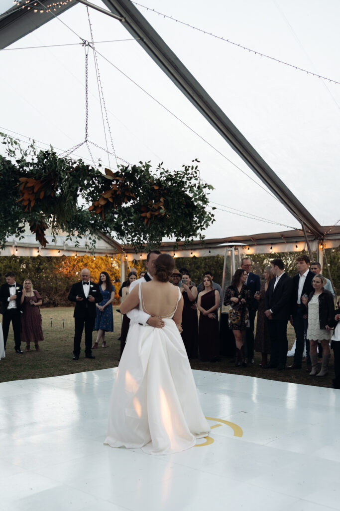 Bride and groom embracing during a Christmas wedding in Waco, Texas